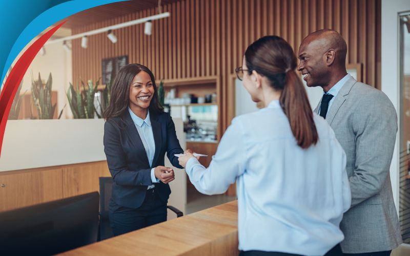 corporate employees walking into a hotel lobby, corporate coach hire, May 2024, UK